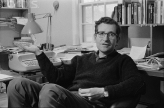 Photo of Chomsky as a young man in his office